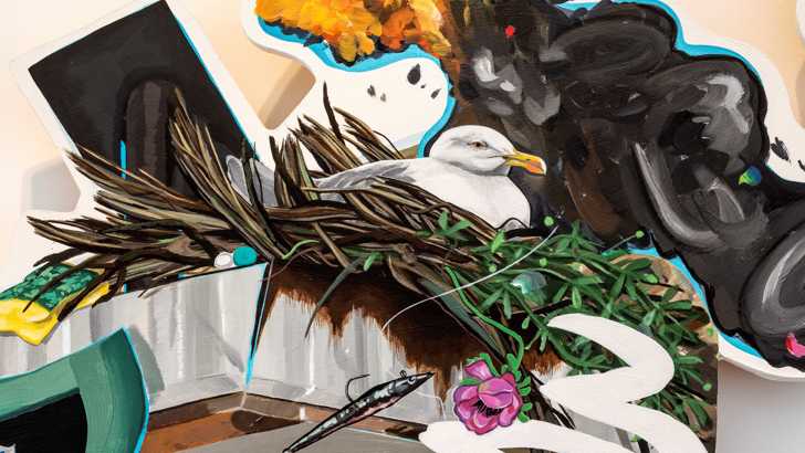 A close-up of an irregularly shaped painting depicting industrial ephemera and a nesting seagull