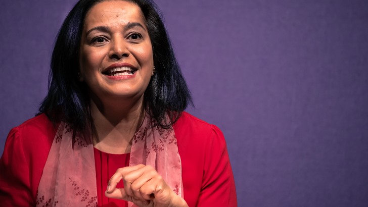 A head and shoulders portrait of performer Lubna Kerr