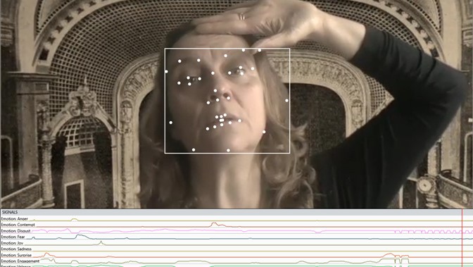 Beverley Hood appears as if on a computer screen, a chart of stats running below her face